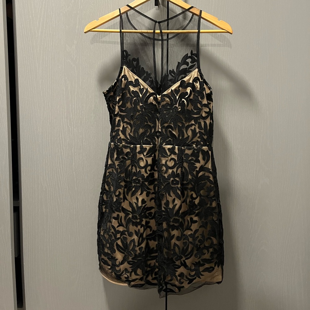 Black lace Bebe dress! Form fitting with mesh shoulders and neck line. Size 8.